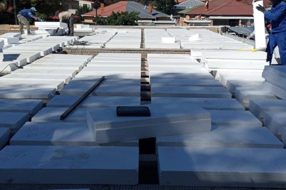 Polystyrene rib and block panels arranged on a rooftop ready for installation
